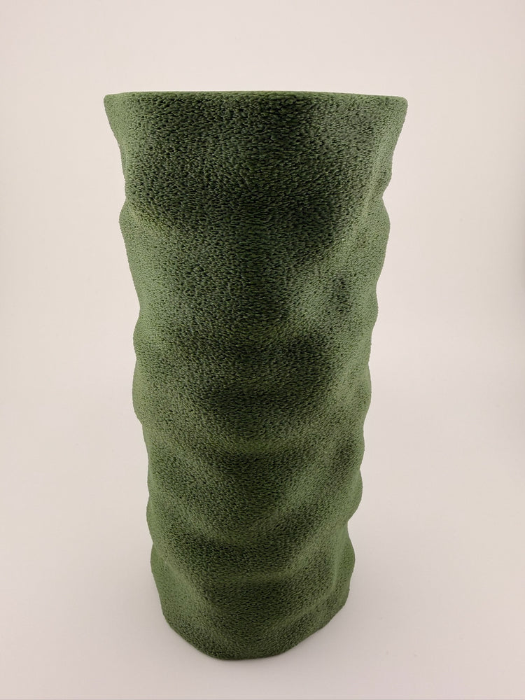 COLUMN sage vase styled on a console