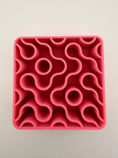 Close-up of the wavy maze interior of the FIZZ pink lemonade holder