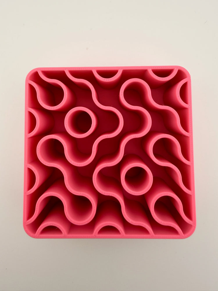 Close-up of the wavy maze interior of the FIZZ pink lemonade holder