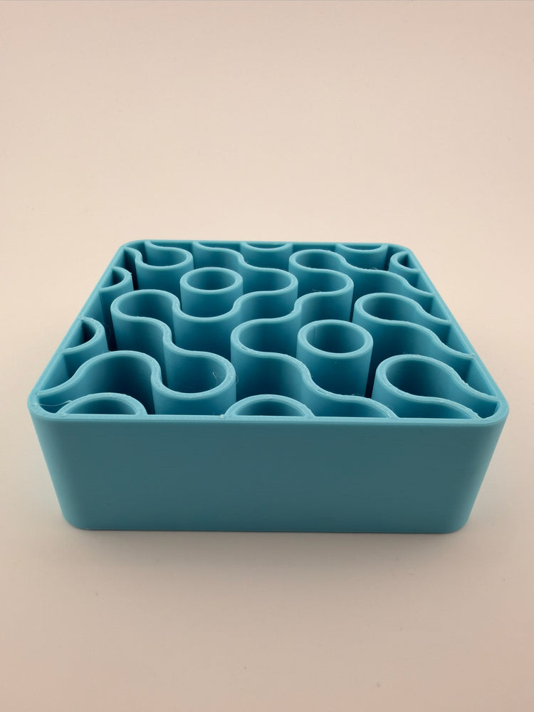 FIZZ pool holder with pens and brushes standing in it