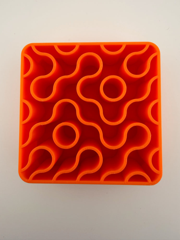 Close-up of the wavy maze interior of the FIZZ tangerine holder