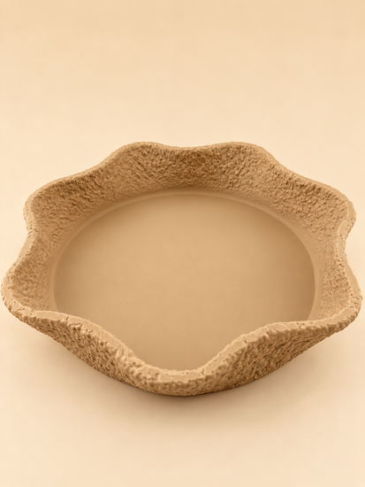 CREST stone-textured tray in vanilla on a console
