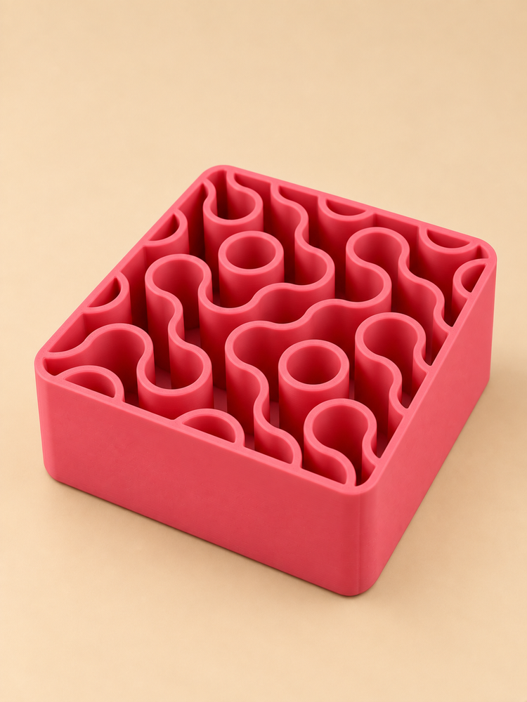 FIZZ wavy pen holder in pink on a desk