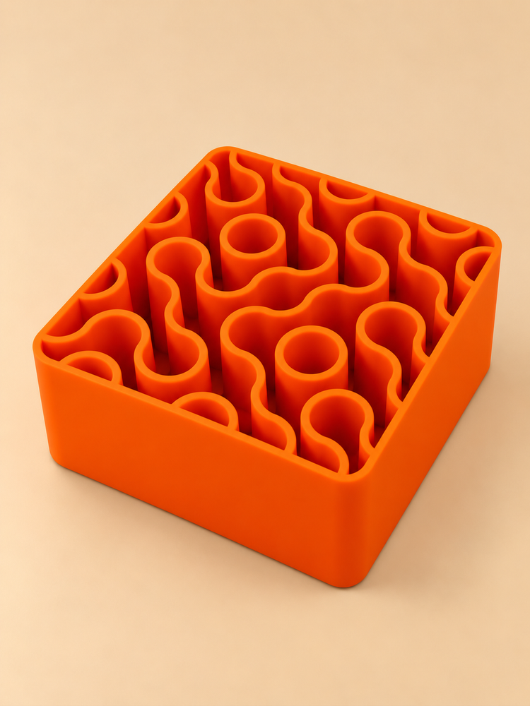 FIZZ wavy pen holder in tangerine on a desk