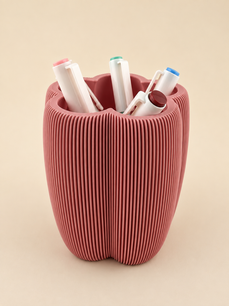 DAISY flower-shaped pen holder in rosewood on a desk