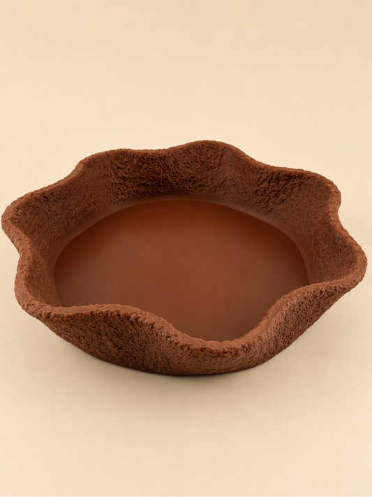 CREST stone-textured tray in cocoa on a console