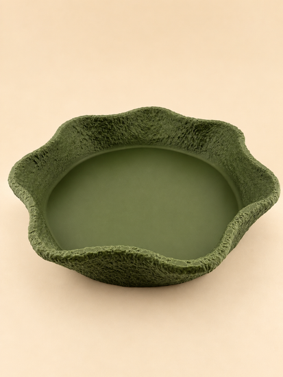 CREST stone-textured tray in sage green on a console